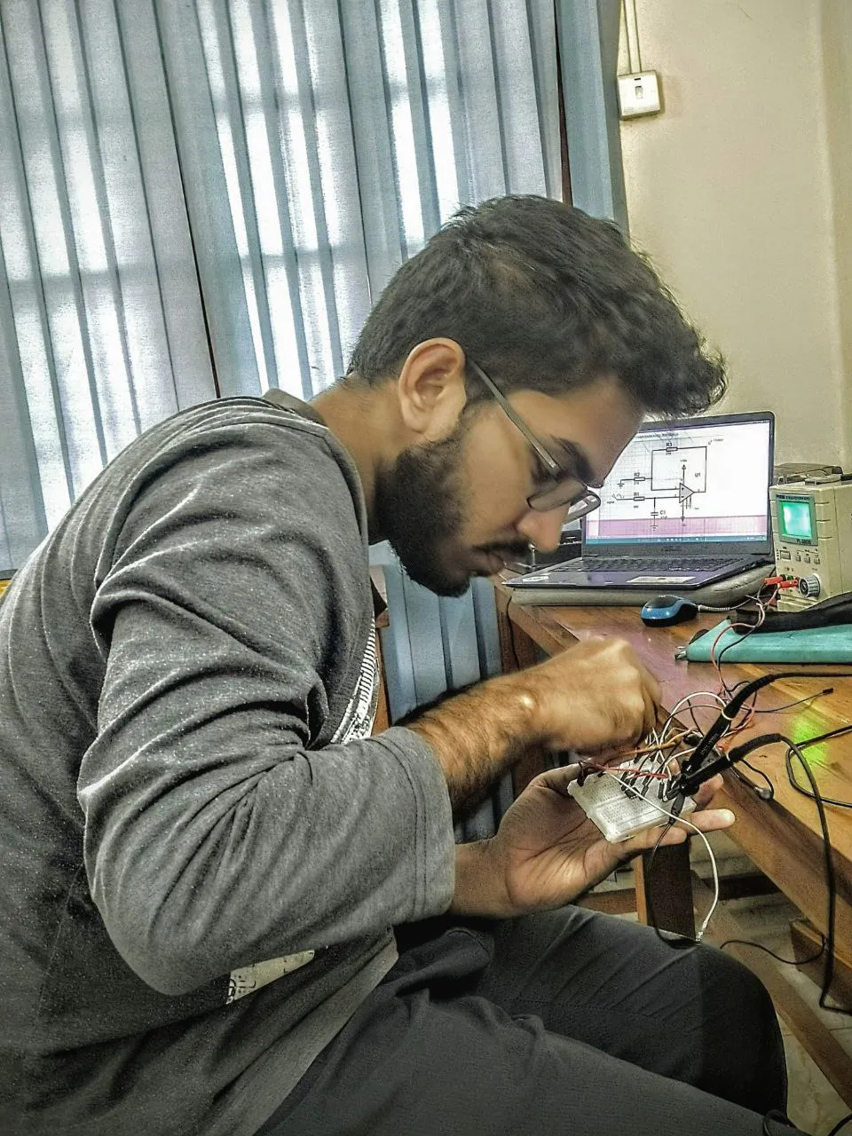 A student preparing a signal conditioning circuit
